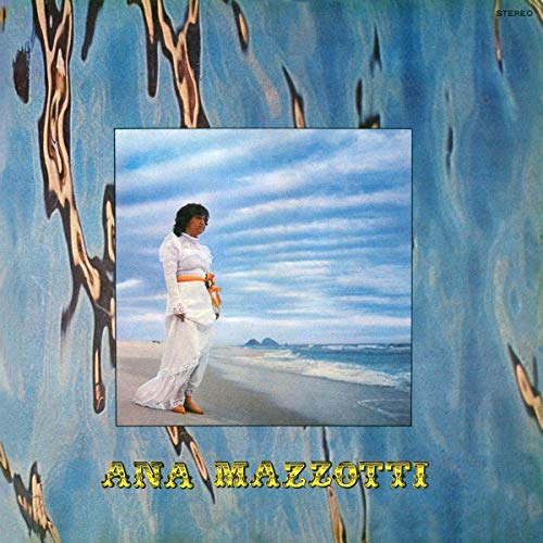 Album cover with a woman in white on a beach, blue background, and yellow text.