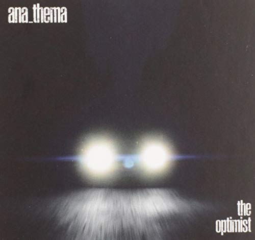 Album cover showing bright car headlights in the dark with text ana_thema the optimist.