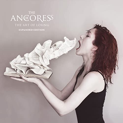 A woman with red hair screams at a book with pages flying into her mouth.