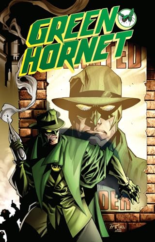 Green Hornet in green suit and hat, standing before a brick wall.