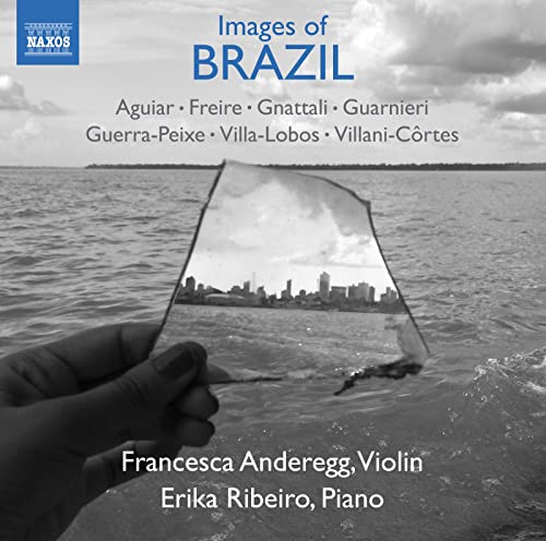 CD cover: seascape reflecting a city skyline, hand holding glass.