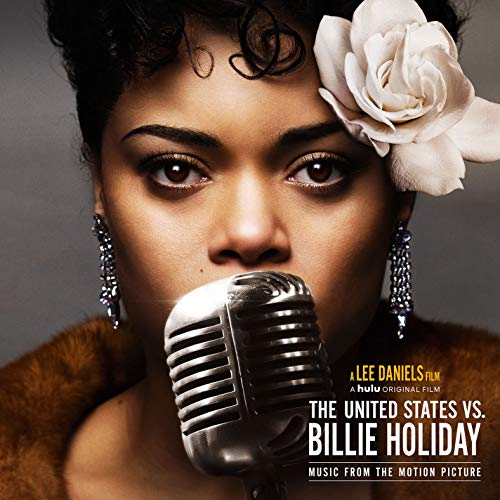 Andra Day as Billie Holiday with a vintage microphone and rose.