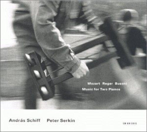 Black and white image of hands playing piano, with text overlay on album cover.