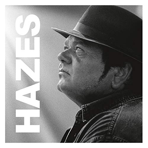Black and white portrait of Andre Hazes wearing a hat, album cover.