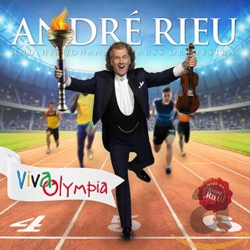 André Rieu holding violin and torch on a running track, with athletes behind.