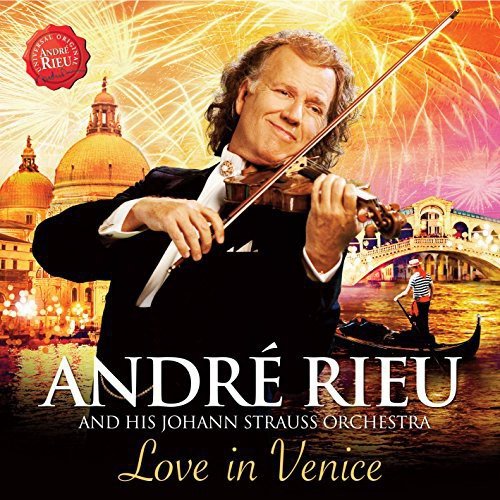 Andre Rieu playing violin with Venice cityscape and fireworks background.