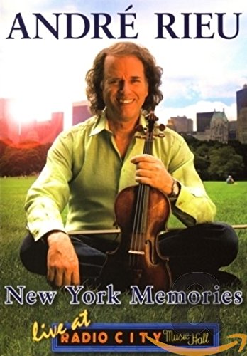 André Rieu holding a violin, with a New York City skyline background.