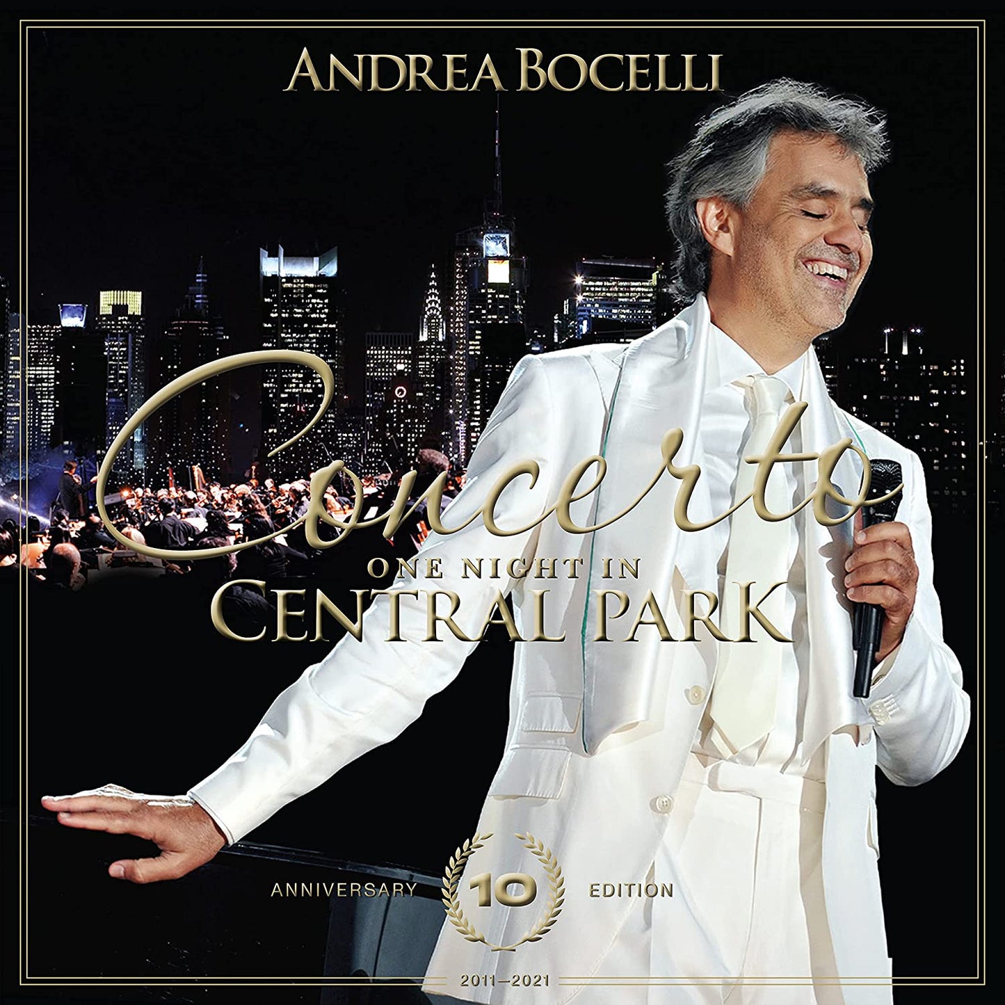 Andrea Bocelli CD cover featuring him in a white suit with a city backdrop.