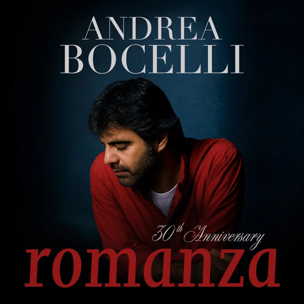Andrea Bocelli album cover, "Romanza (30th Anniversary)," portrait in red.