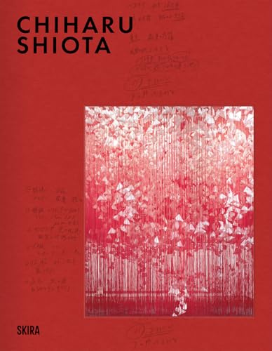 Red book cover featuring a dense, hanging installation of white objects.