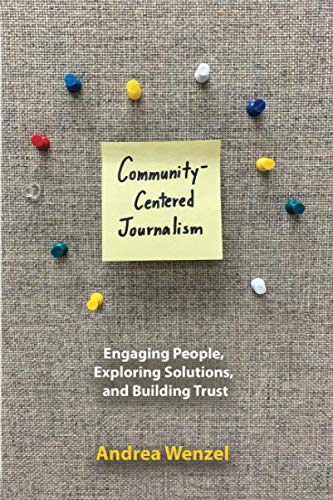 Book cover with handwritten title and colorful pushpins on textured background.