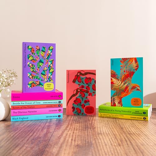 Stack of colorful books with floral and bird illustrations.