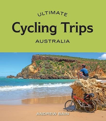 Book cover: cyclist on beach with coastal cliffs, "Ultimate Cycling Trips: Australia".