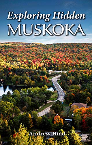 Book cover depicting a winding road through autumn foliage in Muskoka.