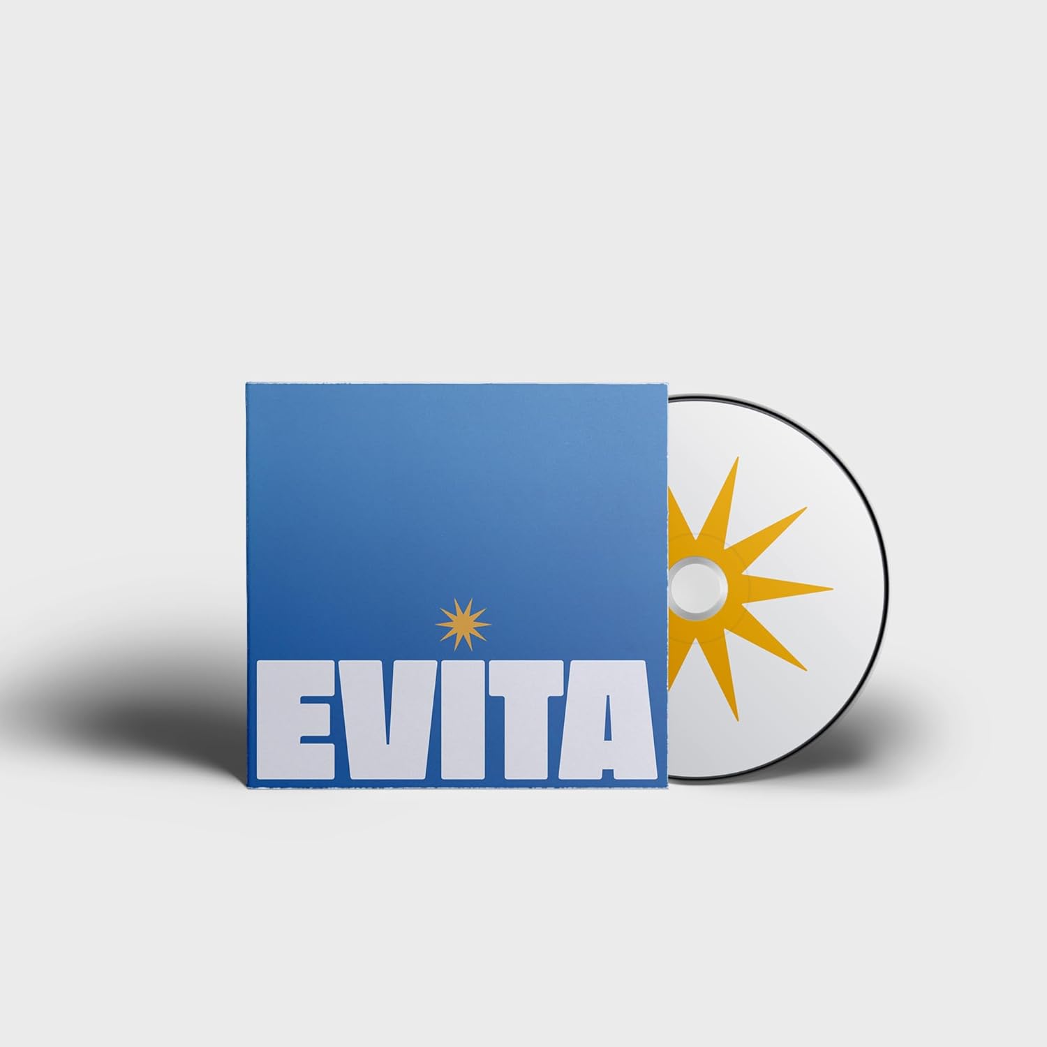 EVITA" CD case with a sunburst design and a silver disc beside it.