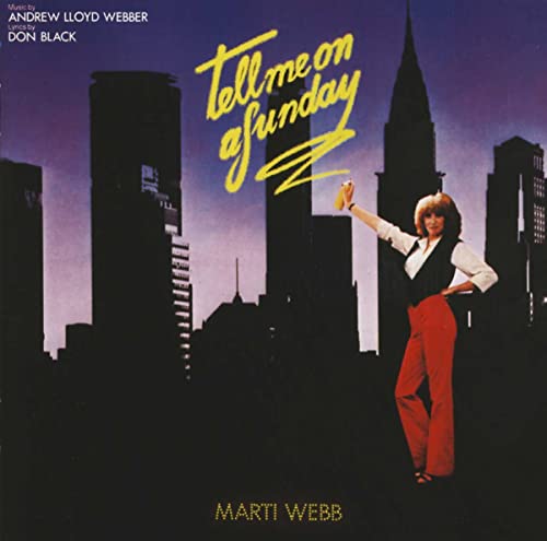 CD cover: woman in red pants poses before a city skyline.