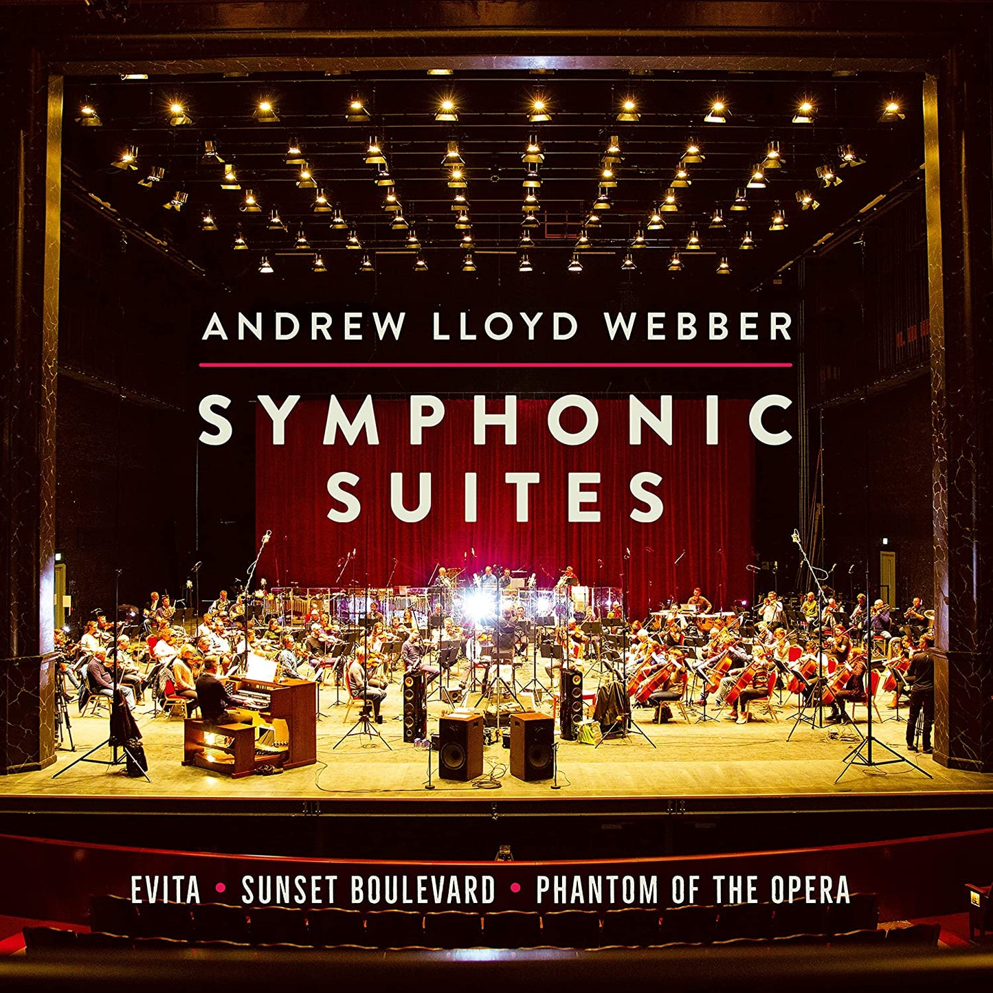 CD cover showing a full orchestra on stage under bright theater lights.