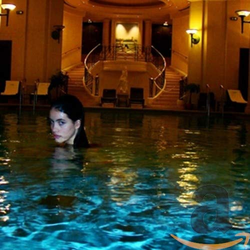 CD cover: woman submerged in a pool, ornate staircase background.