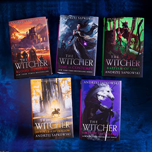 Five Witcher fantasy novels by Andrzej Sapkowski with illustrated covers.