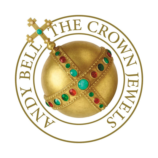 A golden orb with green and red jewels inside a circular Andy Bell logo.
