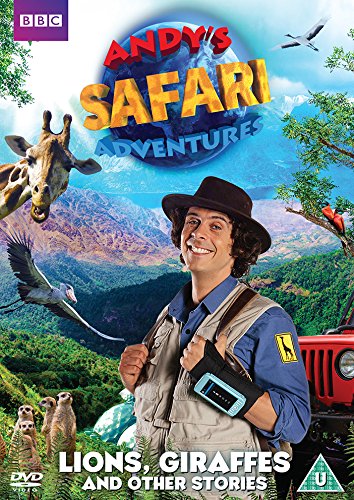 Andy in safari gear with a giraffe, meerkats, and mountains in the background.