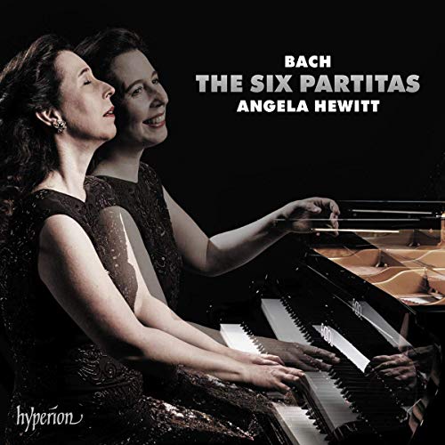 Pianist Angela Hewitt plays a grand piano on this album cover for Bach's Partitas.