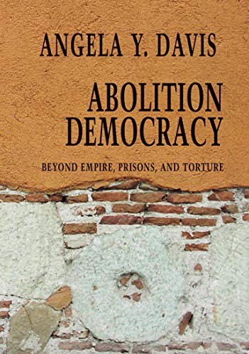 Book cover: "Abolition Democracy" by Angela Y. Davis, with brick wall background.