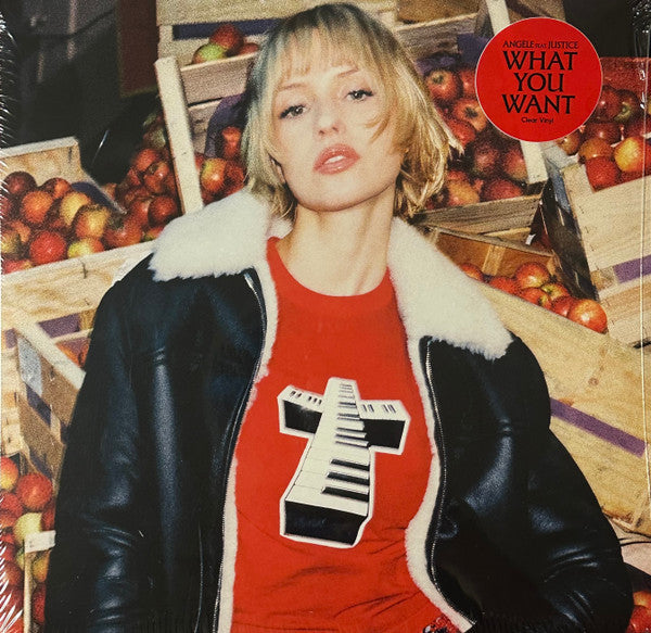 Vinyl record cover featuring a woman in a leather jacket with a keyboard graphic.