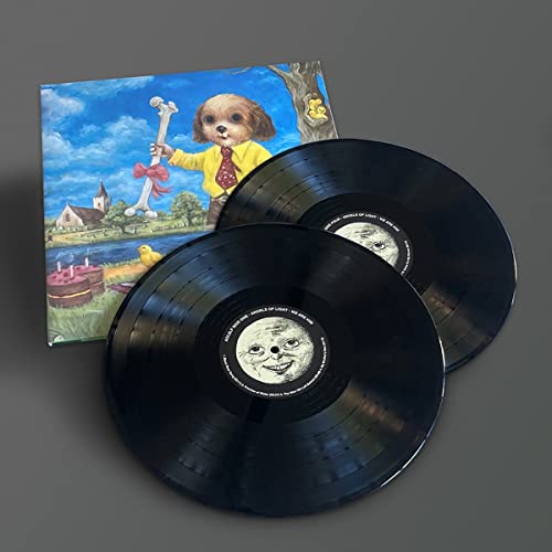 Two black vinyl records with a colorful, surrealist dog portrait cover.