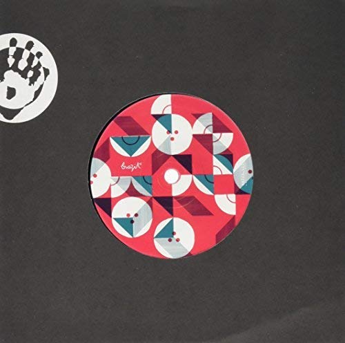Red vinyl record with geometric patterns and a central label.