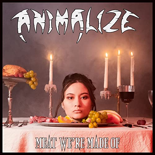 Album cover: woman with fruit and meat, lit by candles.