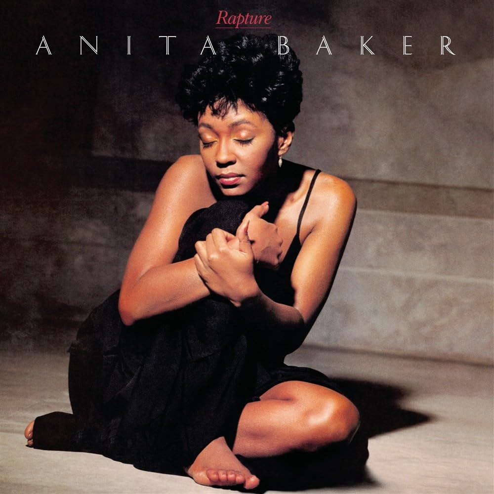 Album cover for Anita Baker’s “Rapture” featuring a portrait of the singer.