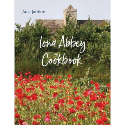 Cookbook cover with abbey ruins, wildflowers, and white cursive title.