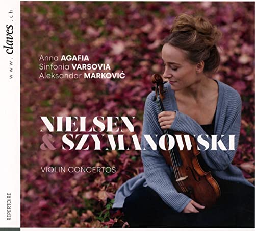 Woman with violin against a blurred autumnal background, CD cover.