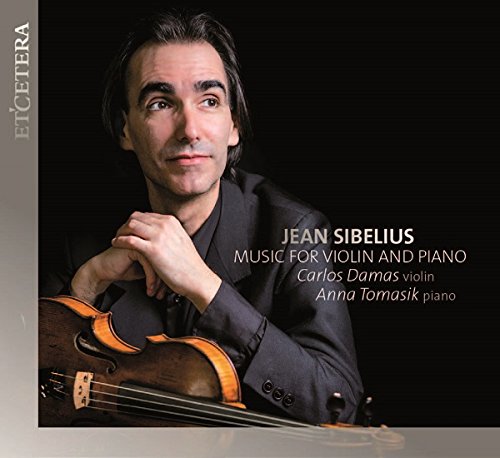 CD cover featuring a man holding a violin against a black background.