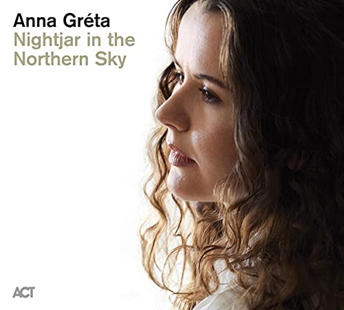 CD cover featuring a close-up portrait of a woman with curly hair.