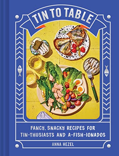 Cookbook cover featuring sardines, salads, and drinks on a blue tiled surface.