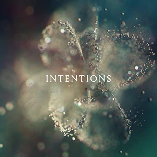 Album cover for "Intentions" by ANNA, with sparkling abstract design.