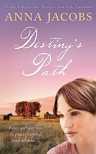 Book cover: woman’s face with rural landscape in soft sunset colors.