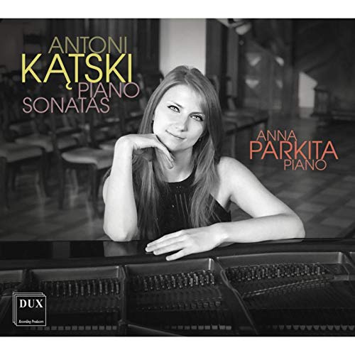 Black and white image of a woman leaning on a piano with text overlay.