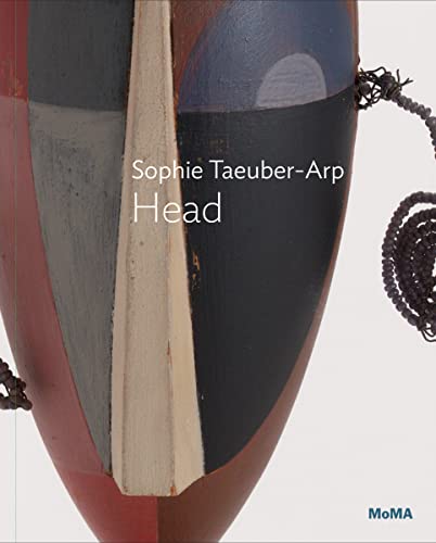 Abstract wooden head sculpture with geometric shapes and dark hair.