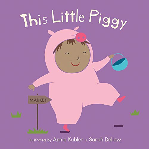 Baby in pink piggy suit walking with a blue bucket.