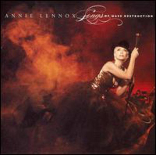 CD cover for Annie Lennox’s “Songs Of Mass Destruction” with a fiery background.