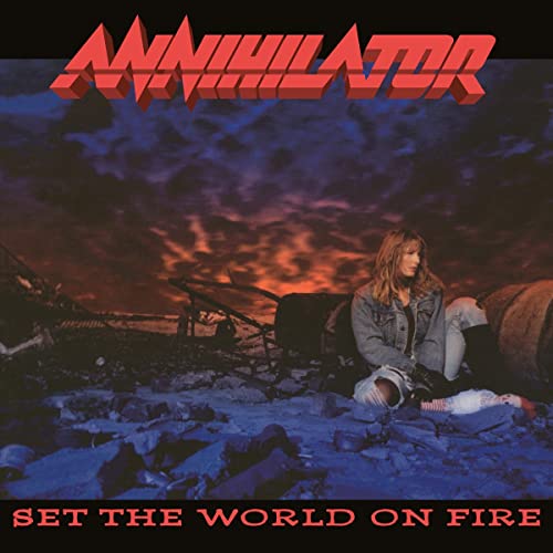 Album cover for Annihilator’s “Set The World On Fire” with a woman amid wreckage.