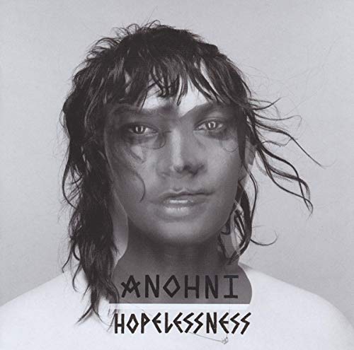 Black and white portrait of Anohni with messy hair and text reading Hopelessness.
