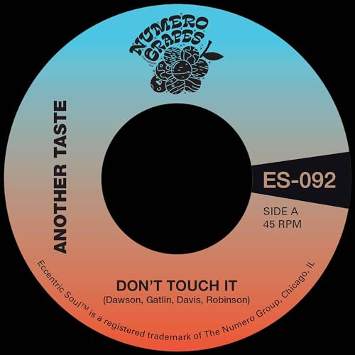Vinyl record label with "Don't Touch It" text and grape illustration.
