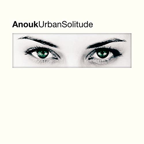 Album cover for Anouk’s “Urban Solitude” featuring a close-up of green eyes.