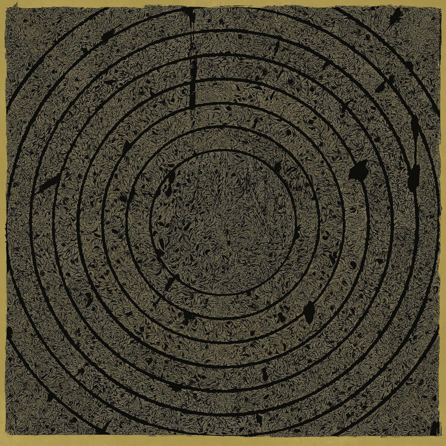 Concentric spiral pattern in dark brown on a tan background.