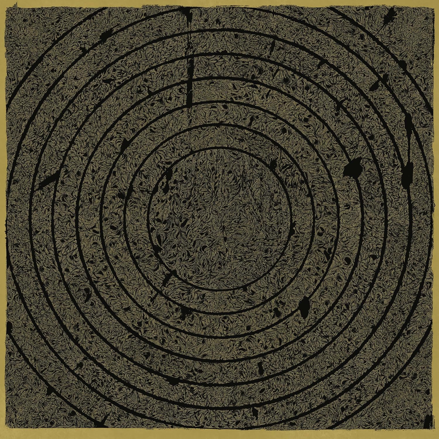 Concentric spiral pattern in dark brown on a tan background.