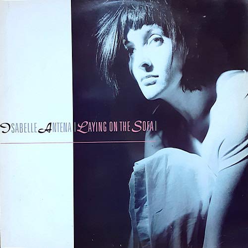 Vinyl record cover featuring a woman lying on a sofa.